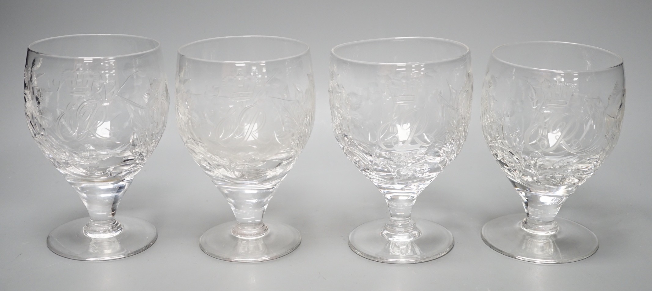 A set of four commemorative 1953 ER II coronation etched wine goblets, 14cms high